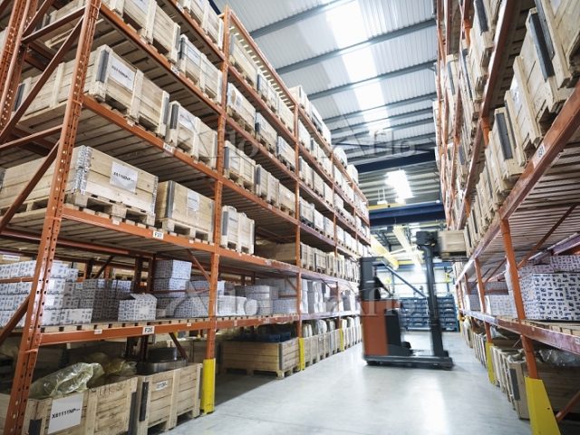 Forklift truck in parts store in factory